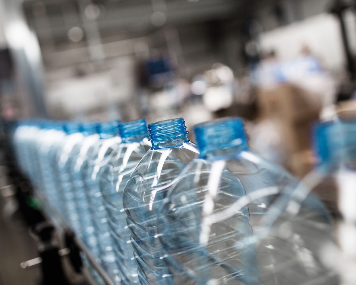 Plastic bottle processing in water factory